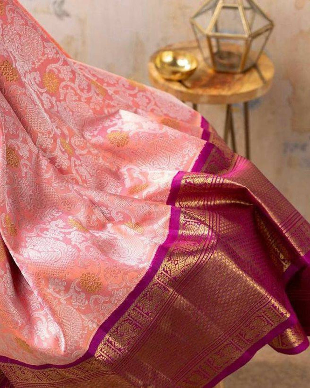 Pure Kanchipuram Silk Saree Peach with designs all over the body and Copper Zari Border