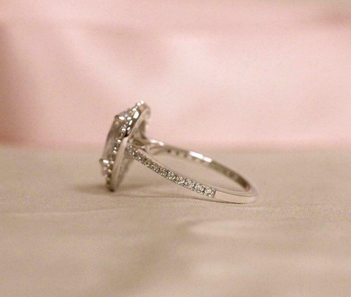 petite hidden halo solitaire plus diamond engagement ring
