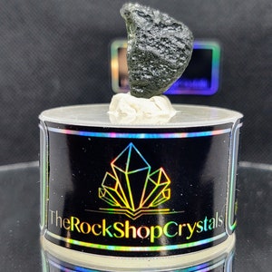 Chlum Moldavite 3.8g half disc with small chip ( shown in pictures)