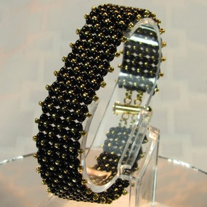 Beaded bracelet - Chenille stitch bracelet - black and gold - slide clasp
