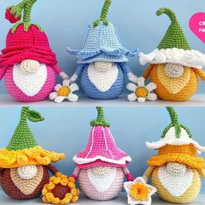 May include: Six crocheted gnome ornaments with flower accents. The gnomes are wearing different colored hats, including pink, blue, yellow, and green. The flowers are white with yellow centers. The gnomes are holding the flowers in their hands. The image includes the text "CROCHET PATTERN PDF".