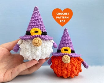 May include: Two crocheted gnomes, one with a white beard and purple hat, the other with an orange beard and purple hat.  The gnomes are wearing black and yellow belts.  Crochet pattern PDF.