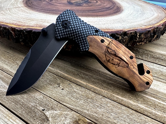 A hand-carved olive wood pocket knife shaped like a trout — 84 favorites don't lie; this is the rare Etsy find that makes a fisher's jaw drop.
