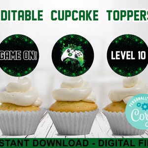 May include: Three 2-inch round cupcake toppers with a green and black digital pattern. The toppers feature the text "GAME ON!" and "LEVEL 10" and a green and white video game controller.