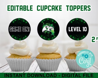 May include: Three 2-inch round cupcake toppers with a green and black digital pattern. The toppers feature the text "GAME ON!" and "LEVEL 10" and a green and white video game controller.