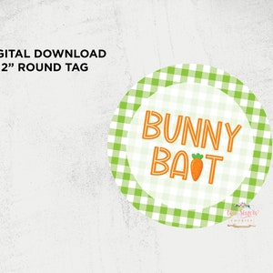 May include: A green and white gingham circle with the text "Bunny Bait" in orange letters and a small orange carrot graphic. The circle is 5 cm in diameter.