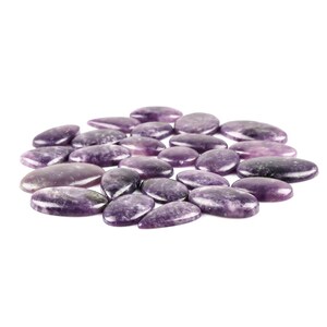 May include: A collection of 20 purple and white lepidolite cabochons, oval and teardrop shaped, arranged in a circle on a white background.