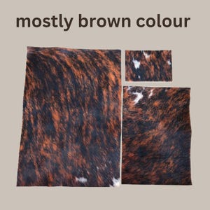 May include: Three pieces of cowhide with a mostly brown color. The hides have a dark brown and orange brindle pattern with some white patches. The text "mostly brown colour" is at the top of the image.