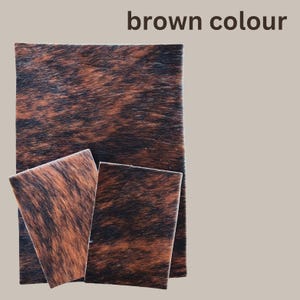 May include: Three pieces of brown and black patterned leather. The text "brown colour" is at the top of the image. The leather has a natural, textured appearance with a mix of dark brown and black streaks.