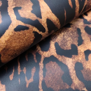 Bruna djurmönstrade läderskinn med stort naturligt leopardmönster