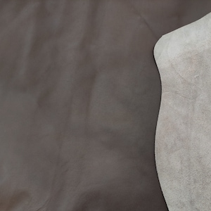 Premium dark brown cow leather pieces for bags and crafts, shown folded to  reveal a grayish beige suede-like backside