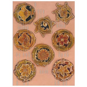 May include: A collection of intricately carved leather designs, featuring floral and abstract patterns in shades of yellow, orange, and brown. Each design is circular or stylized, with detailed textures and shading. The designs are labeled with alphanumeric codes.