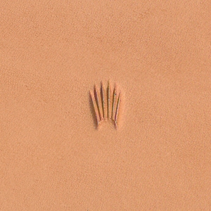 May include: A close-up of a brown leather surface with a small, embossed crown design.