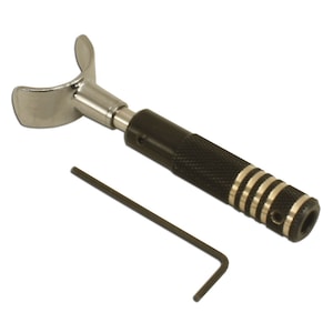 May include: A black leather crafting tool with a silver blade and a gold accent ring. The tool has a black handle with a textured grip and a small allen wrench.