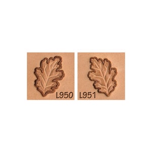 May include: Two leather stamps with an oak leaf design. The stamp on the left is labeled L950 and the stamp on the right is labeled L951.
