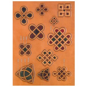 May include: A sheet of leather with various Celtic knot designs in different colors, including red, green, blue, and black. The designs are labeled with numbers and letters.