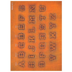 May include: A sheet of embossed leather with the alphabet in a western-style font. The letters are deeply carved into the orange-brown leather. The text "20mm (¾")" is at the top left.
