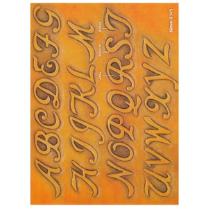 May include: A sheet of uppercase alphabet letters in a decorative, serif font. The letters are in a warm, golden-brown color with a darker outline, set against a gradient orange background. The text "32mm (1 1/4")" is visible in the upper right corner.