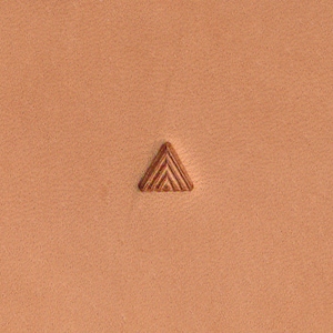 May include: A close-up of a brown leather surface with a small, embossed triangle design. The triangle has a series of lines running parallel to each other.
