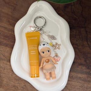 May include: A rustic wooden sign with the text "Welcome to our home" in white lettering. The sign features a distressed finish and a simple, inviting design, perfect for a front porch or entryway.