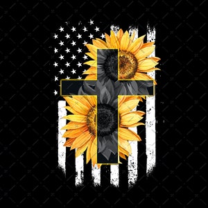 May include: A black cross with a gold outline is centered on an American flag. The cross is surrounded by two sunflowers, one on each side.