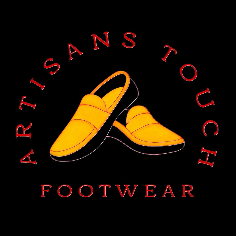 May include: Artisans Touch Footwear logo on a black background. The logo features a pair of yellow and black slip-on shoes. The words "ARTISANS TOUCH" are arched above the shoes, and "FOOTWEAR" is below, all in red.