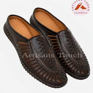 May include: A pair of brown leather sandals with a woven design and open toe. The sandals have a slip-on style and a comfortable, cushioned insole.