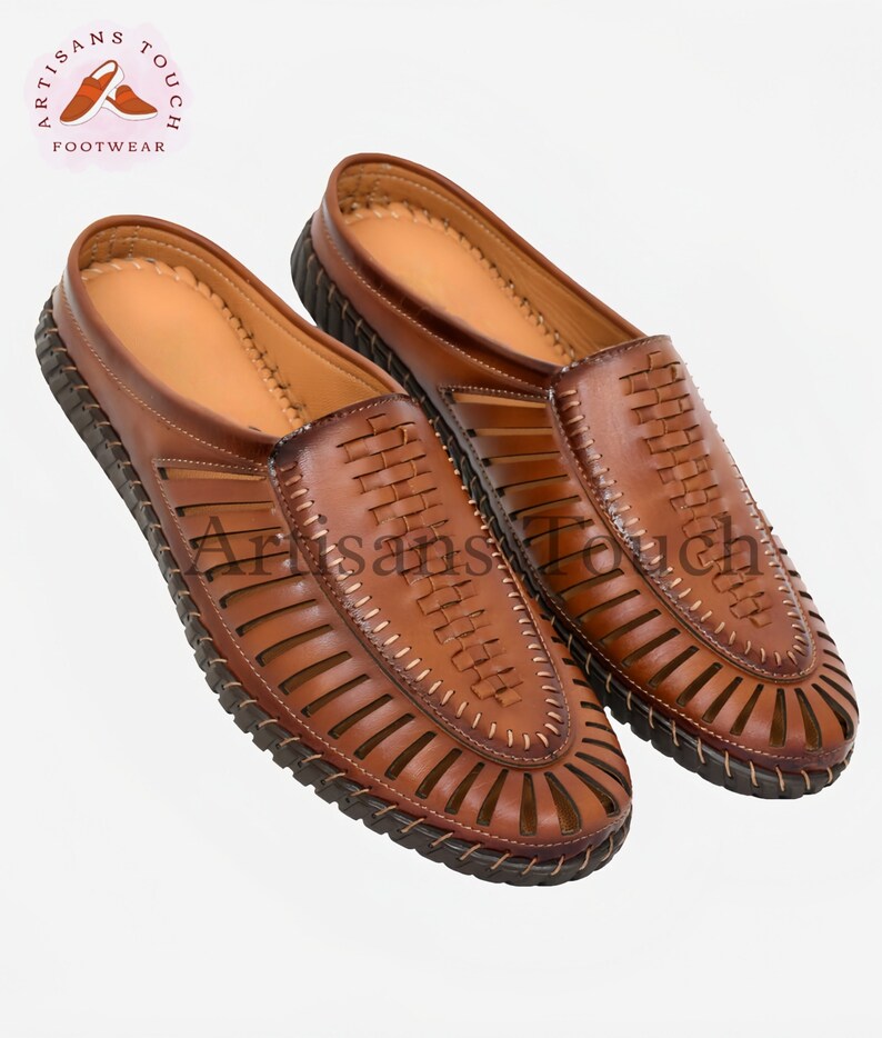May include: A pair of brown leather sandals with a woven design and a closed toe. The sandals have a slip-on style and a comfortable look.