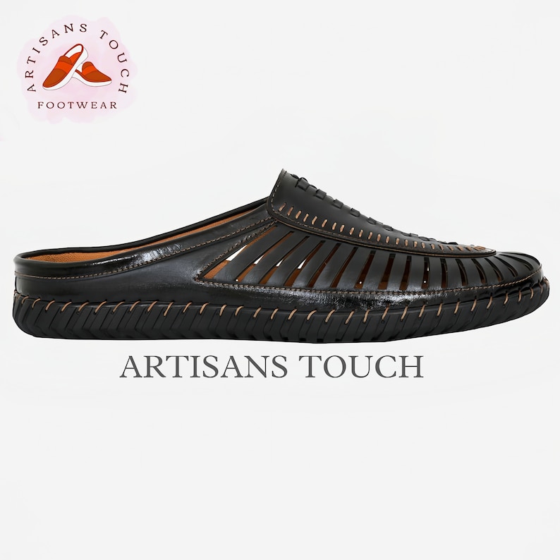 May include: Black leather slip-on sandals with a woven design and a stitched sole. The sandals have a brown leather lining and a brown stitched trim. The brand name "ARTISANS TOUCH" is printed on the sole.