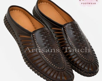 May include: A pair of brown leather sandals with a woven design and open toe. The sandals have a slip-on style and a comfortable, cushioned insole.