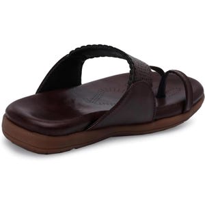 May include: A pair of brown leather sandals with a decorative stitch detail around the ankle strap. The sandals have a closed toe and a comfortable looking sole.