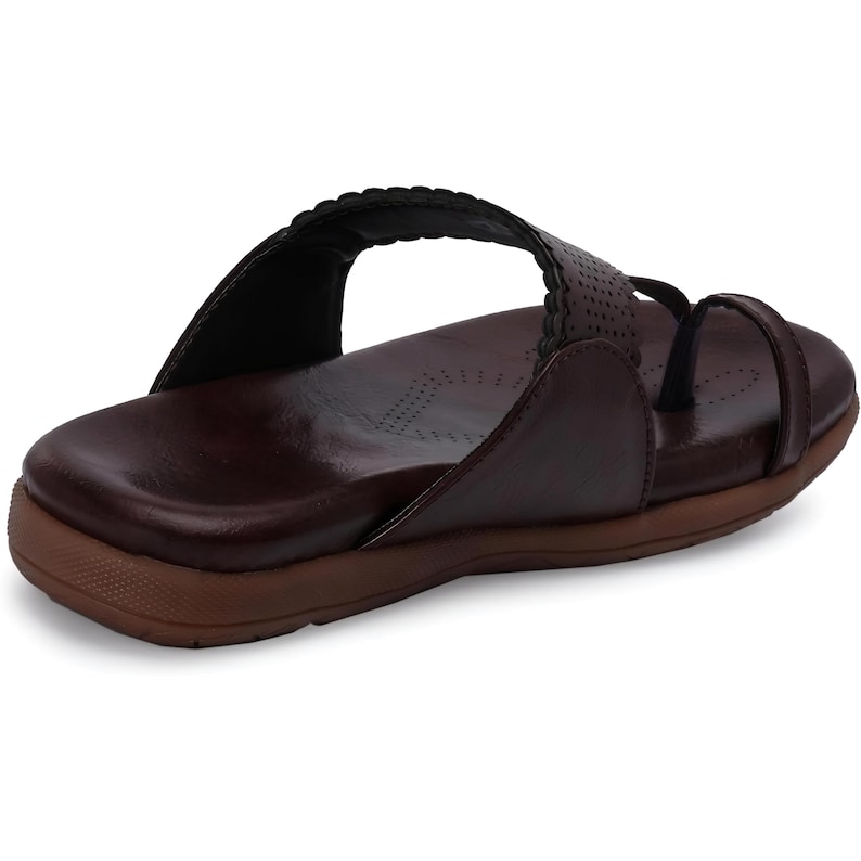 May include: A pair of brown leather sandals with a decorative stitch detail around the ankle strap. The sandals have a closed toe and a comfortable looking sole.