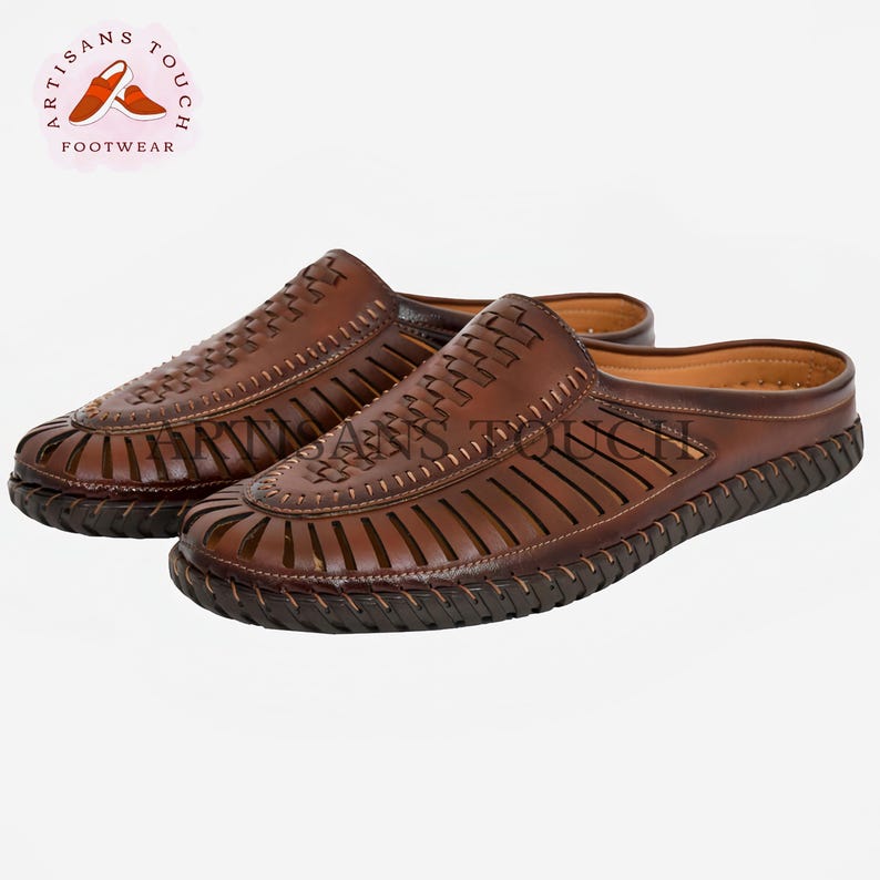 May include: Brown leather sandals with a woven design and an open toe. The sandals have a brown leather strap across the top of the foot and a brown leather sole.