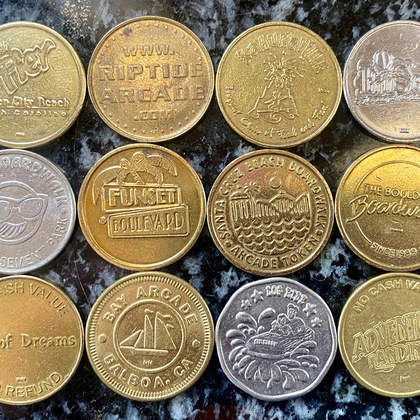 A Rad Collection of 12 Vintage Arcade Tokens from the 80’s including Santa Cruz Boardwalk, Funset Boulevard, Six Flags & Riptide Arcade