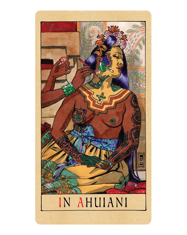 May include: A rectangular tarot card featuring an illustration of a person with long dark hair, wearing a floral headpiece and a yellow skirt, being painted by another hand. The card includes the text IN AHUIANI at the bottom in black and red.