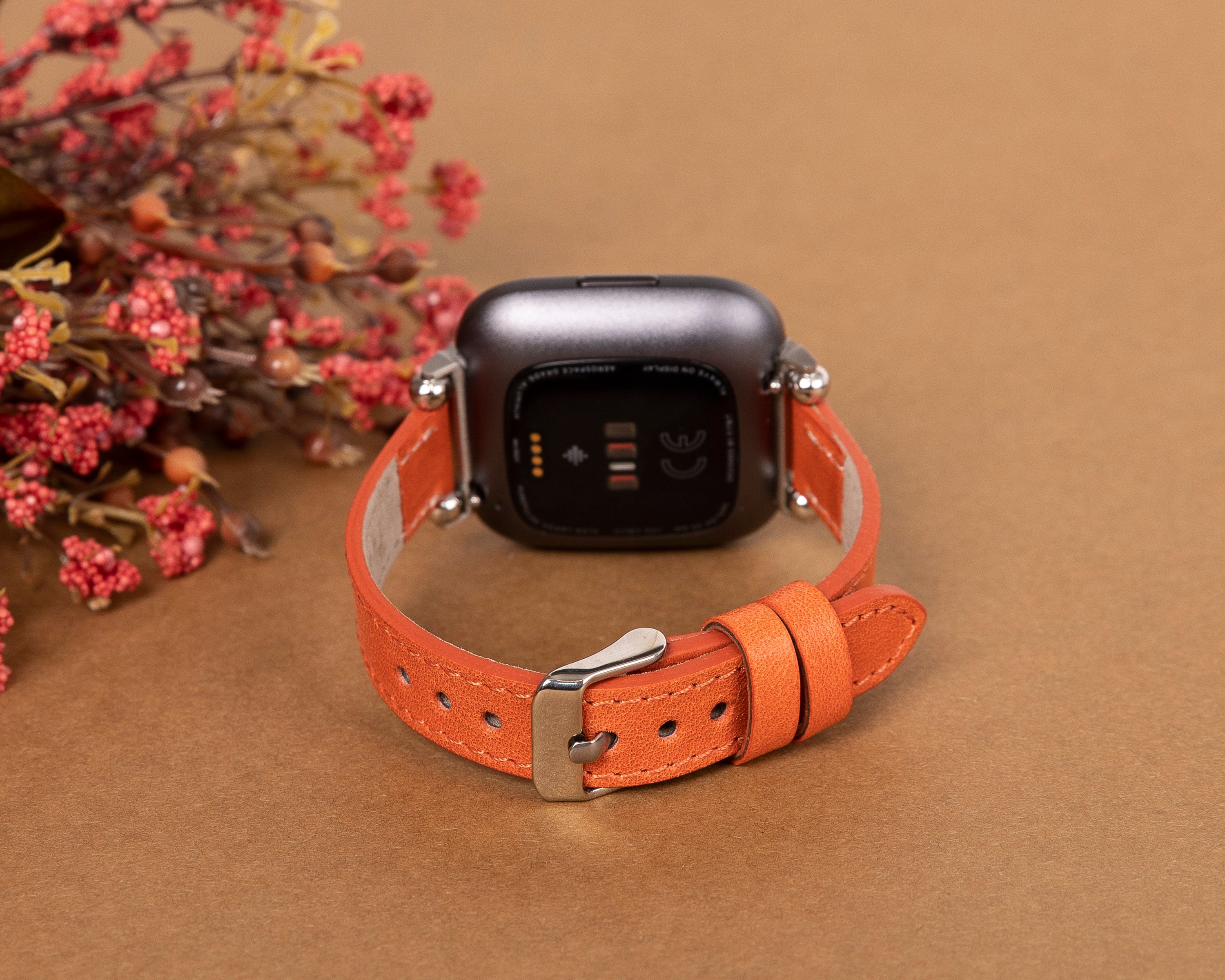 orange fitbit versa band