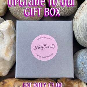 May include: A grey gift box with a pink sticker that says "Holly and Lili" and "hollyandlili.etsy.com". The text "Upgrade to our GIFT BOX" is at the top of the image and the text "For ONLY &pound;3.00 Extra per ITEM" is at the bottom of the image.