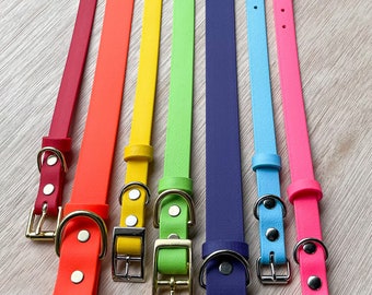 May include: Seven colorful dog collars with gold and silver buckles. The collars are red, orange, yellow, green, blue, light blue, and pink.