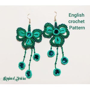 May include: A pair of green and teal crocheted earrings with a butterfly design and dangling beads. The earrings are labeled "English crochet pattern".