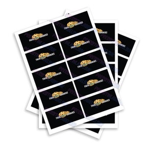 May include: A stack of black and white labels with the text "Thin Mint Cookies" and a graphic of two chocolate chip cookies.