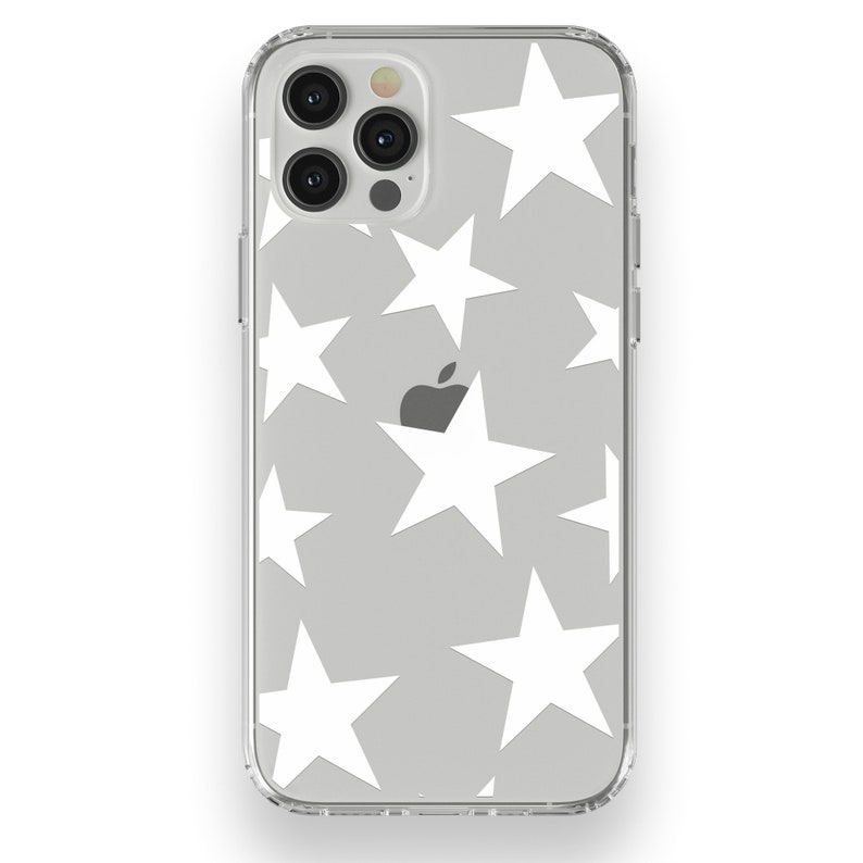 May include: Transparent phone case featuring a grey backdrop adorned with white stars. The case has a clear frame and covers the phone's back and sides. The Apple logo is visible.