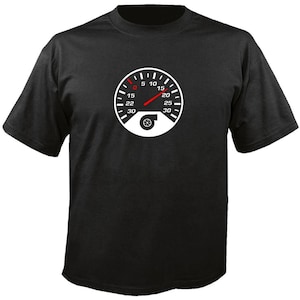 May include: Black t-shirt featuring a white speedometer graphic with a red needle and a turbocharger symbol. The speedometer displays numbers from 0 to 30, with the needle pointing near the 15 mark. A casual tee for car enthusiasts.