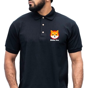May include: Black polo shirt with a Shiba Inu dog graphic and the text "Shiba Inu" on the left chest.