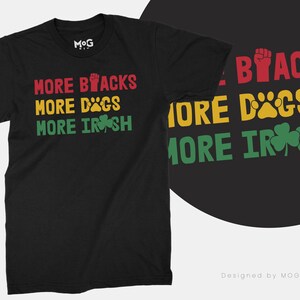 Op de afbeelding: Zwart T-shirt met de tekst "More Blacks More Dogs More Irish" in rood, geel en groen.