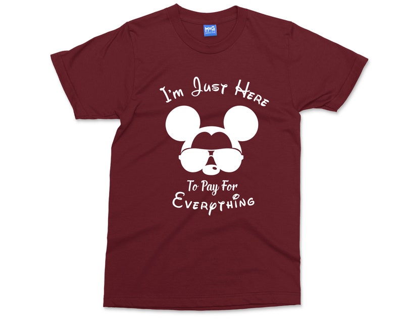 May include: Burgundy t-shirt featuring a white silhouette of Mickey Mouse wearing sunglasses and the text "I'm Just Here To Pay For Everything".