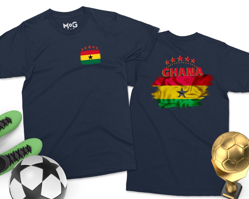 May include: Two navy blue t-shirts with a red, yellow, green, and black flag design. The flag has a black star in the center and the word "GHANA" in red letters. One shirt has a smaller version of the flag on the left chest.