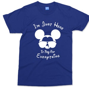 May include: A royal blue t-shirt featuring a white graphic of Mickey Mouse wearing sunglasses and the text "I'm Just Here To Pay For Everything".