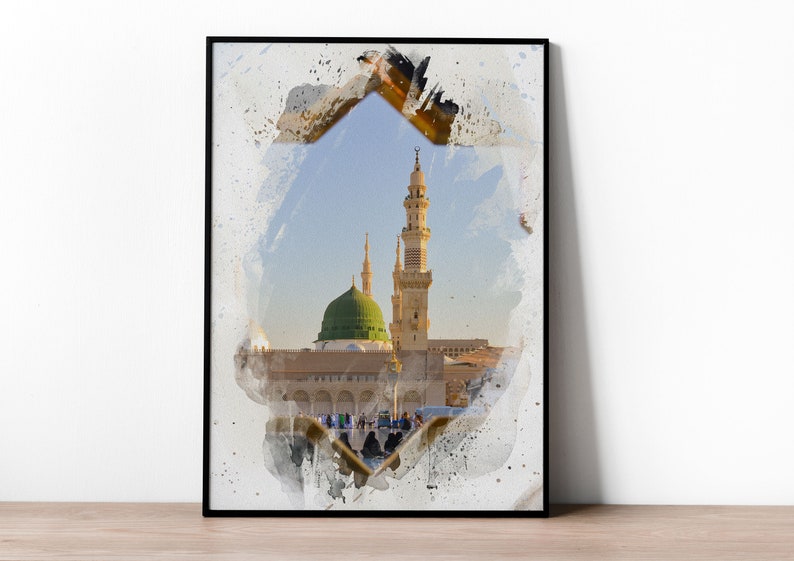 May include: A watercolor painting of a mosque with a green dome and a tall minaret. The mosque is surrounded by a white wall and there are people walking around it. The painting is framed in a black frame.