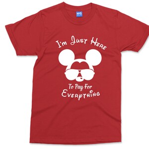 May include: Red t-shirt featuring a white silhouette of Mickey Mouse wearing sunglasses and the text "I'm Just Here To Pay For Everything".