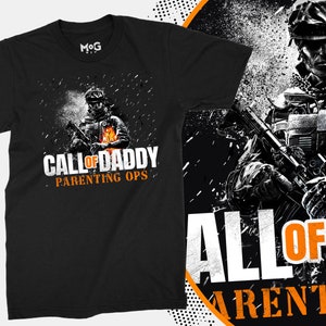 May include: Black t-shirt featuring a graphic of a soldier holding a gun and the text "Call of Daddy Parenting Ops".